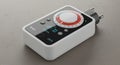 A programmable digital timer switch with a sleek, rectangular design. It features a Royalty Free Stock Photo
