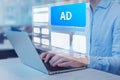 Programmatic in-feed advertisement on computer screen. Person viewing website with inbound ads to optimize click through rate and Royalty Free Stock Photo