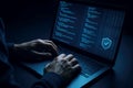 Programmer Coding on Laptop in Dark Room with Security Shield Icon Keywords: programming, coding, software development, Royalty Free Stock Photo