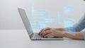 Programmer coding software on laptop with virtual interface Royalty Free Stock Photo