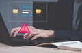 programmer, developer using computer laptop with triangle caution warning sign for notification error and maintenance concept. Royalty Free Stock Photo