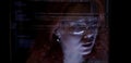 Programmer or Developer working in dark room with computer code reflected on their monitor Royalty Free Stock Photo