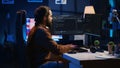 Programmer developing code on computer screen while in personal office Royalty Free Stock Photo