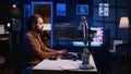 Programmer developing code on computer screen while in personal office Royalty Free Stock Photo