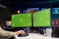 Programmer developing software applications using green screen computer Royalty Free Stock Photo