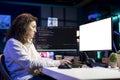 Programmer doing software debugging on isolated screen PC