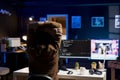 Programmer doing software quality assurance, stretching arms behind back
