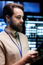 Programmer does server examination Royalty Free Stock Photo