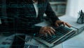 Focused Programmer Working on Laptop with Code and Data Visualization Overlay in Modern Office Environment xenic Royalty Free Stock Photo