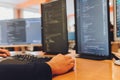 Programmer Hand Faster typing on keyboard. Programmer coding program and website put on wood table with computer and Royalty Free Stock Photo