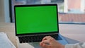 Programmer hand working laptop with green screen closeup. Unknown businesswoman Royalty Free Stock Photo