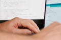 Programmer hands on blurred code