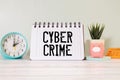 The programmer holds a paper with the text cyber crime on the background of the monitor and computer Royalty Free Stock Photo