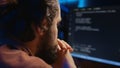 IT admin frowning while looking at screen, confused by errors, close up shot