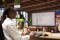 Programmer in home office looking at UI on PC screen, typing code Royalty Free Stock Photo