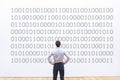 Programmer looking at binary code, coding concept, data encryption