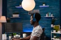 Programmer man wearing headphones typing binary code for website security Royalty Free Stock Photo