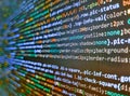 Programmer occupation job. Minificated web development javascript code close up in sunset rays. Modern technology background. Web Royalty Free Stock Photo