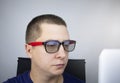 The programmer`s glasses reflect lines of code. Programming, development of applications, sites and other things. Software