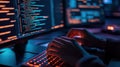 Programmer's hands coding on a computer in a dark workspace Royalty Free Stock Photo