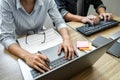 Programmer Team of  Developing programming and website working in a software develop company office, writing codes and typing data Royalty Free Stock Photo