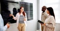Programmer Team Meeting With TV Screen In Office