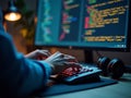 Programmer Typing Code on Backlit Keyboard at Night Royalty Free Stock Photo