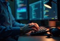 Programmer Typing Code on Backlit Keyboard at Night Royalty Free Stock Photo