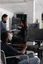 It programmer in wheelchair typing html code in coding office Royalty Free Stock Photo