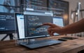 Programmer working on code with a transparent display and multiple monitors, ai-generated Royalty Free Stock Photo