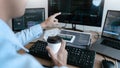 Programmer working On Computer In IT Office Typing Data Coding in software and checking code on computer screen