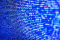 Programmer working on computer screen. Data bits computer bits, shadow and dark vignette effect. Tensorflow AI concept. SEO