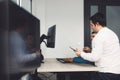 Side view of two colleagues working on a project together developing a new code Royalty Free Stock Photo