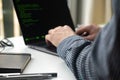 Programmer working on laptop at office. Focus on programming code Royalty Free Stock Photo