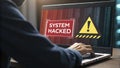 Programmer working on a laptop with system hacked alert on screen and warning sign, data safety and cybersecurity concept Royalty Free Stock Photo