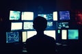 Programmer working late at night on multiple computer screens