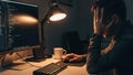 Programmer working late at night, stressed and tired, coding on computer Royalty Free Stock Photo
