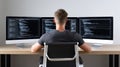 Programmer Working with Multiple Monitors and Coding Software Royalty Free Stock Photo