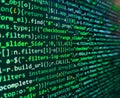Programmer working in a software develop company office. HTML and CSS code developing screenshot. Vignette light and dark shadow Royalty Free Stock Photo