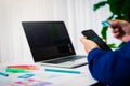 Programmer working test new web design on computer laptop with mobile phone in office. Programming Business Concept