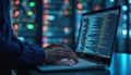 Programmer works on laptop in server room. Coding, programming concept. IT engineer typing on keyboard. Database and cyberspace Royalty Free Stock Photo
