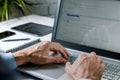 Programmer writing code on laptop computer in office. website programming, software development