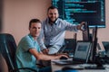 Programmers engrossed in deep collaboration, diligently working together to solve complex problems and develop Royalty Free Stock Photo