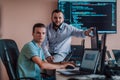 Programmers engrossed in deep collaboration, diligently working together to solve complex problems and develop Royalty Free Stock Photo