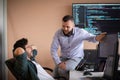 Programmers engrossed in deep collaboration, diligently working together to solve complex problems