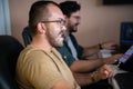 Programmers engrossed in deep collaboration, diligently working together to solve complex problems and develop