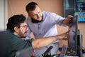 Programmers engrossed in deep collaboration, diligently working together to solve complex problems