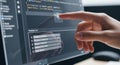 Programmers Hand Pointing at Code on a Computer Screen Royalty Free Stock Photo