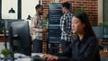 Programmers leaving after analyzing source code on wall screen tv comparing errors using digital tablet Royalty Free Stock Photo
