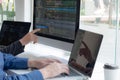 Programmers work on the development of coding and coding technology on white desks and website design, software, data processing Royalty Free Stock Photo